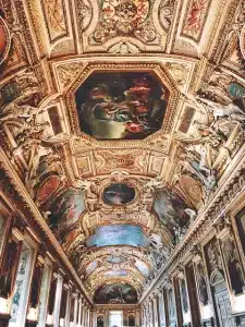 An ornately decorated ceiling at Versailles